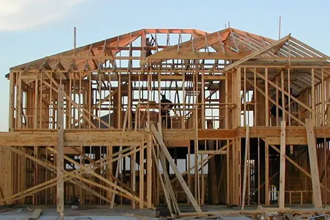 Wood-frame house under construction in Katy, Texas; archival photograph by Jaksmata